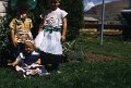 three kids on lawn